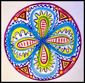 Colorful patterned mandala drawn with marker on paper